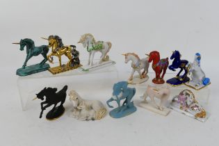 A group of Unicorn figures, predominantly Franklin Mint porcelain examples,