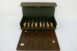 A Studio Anne Carlton Roman themed chess set with 10.5 cm (h) king. [2].