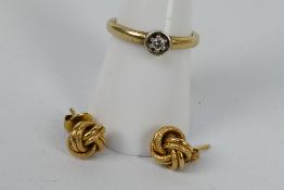 A 9ct yellow gold ring set with small diamond, size N+½ and a pair of earrings stamped 375,
