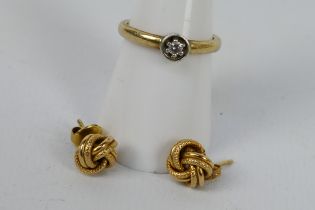 A 9ct yellow gold ring set with small diamond, size N+½ and a pair of earrings stamped 375,