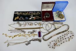 A collection of costume jewellery to include necklaces, bracelets, rings, brooches,