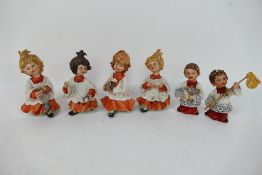 A group of capodimonte figures to include altar boys and a choir, choristers signed Rori,