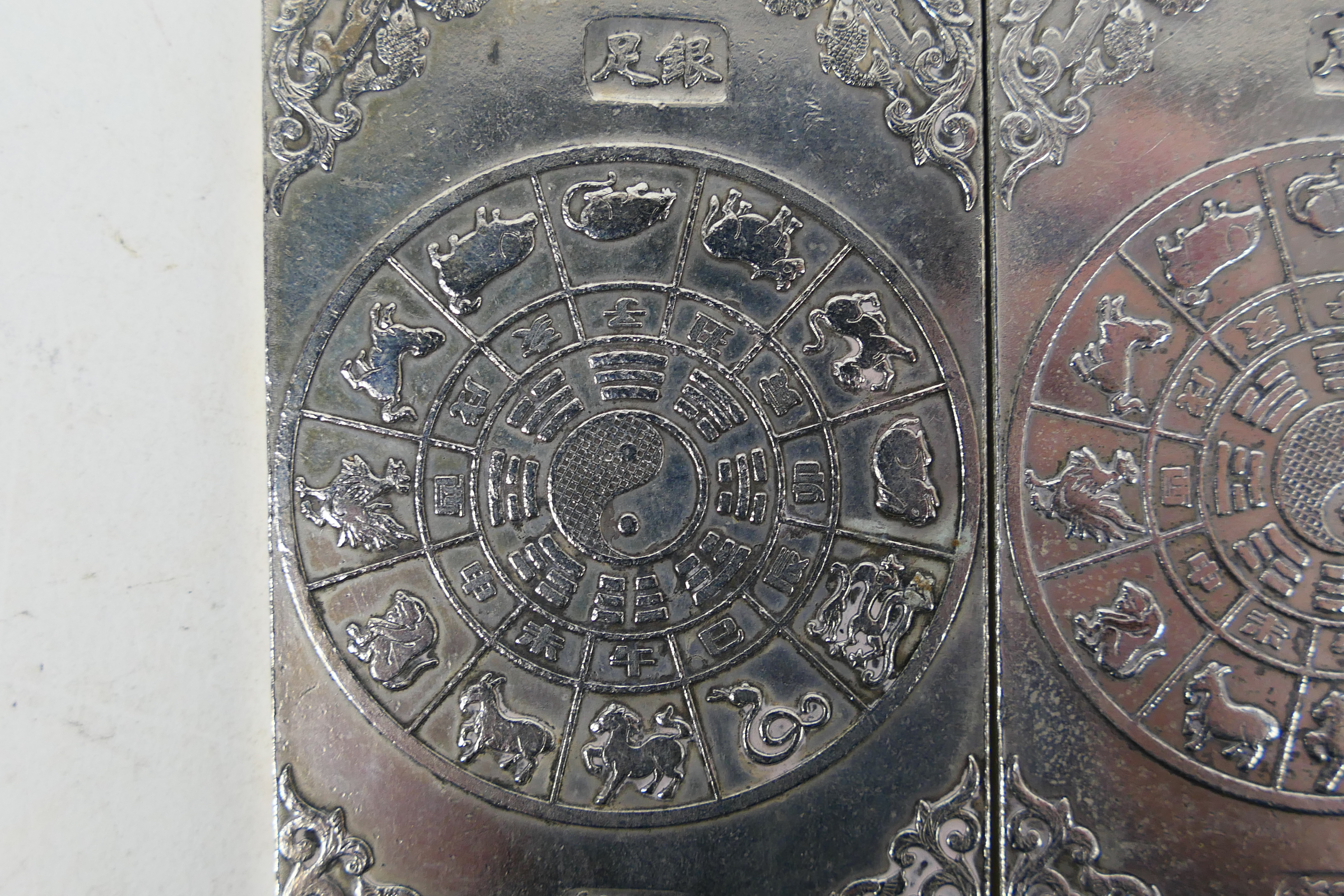 Two Chinese white metal plaques / trade tokens one decorated with a warrior riding a tiger, - Image 5 of 6