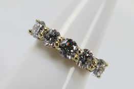An 18ct yellow gold five stone Diamond ring containing five round brilliant cut diamonds in yellow