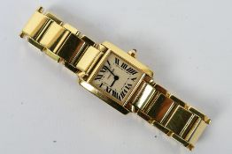 A lady's 18ct yellow gold Cartier Tank Francaise bracelet watch with quartz movement,