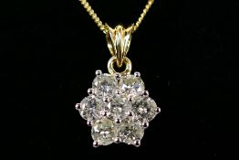 An 18ct white gold Diamond pendant containing seven round brilliant cut diamonds in a claw-set