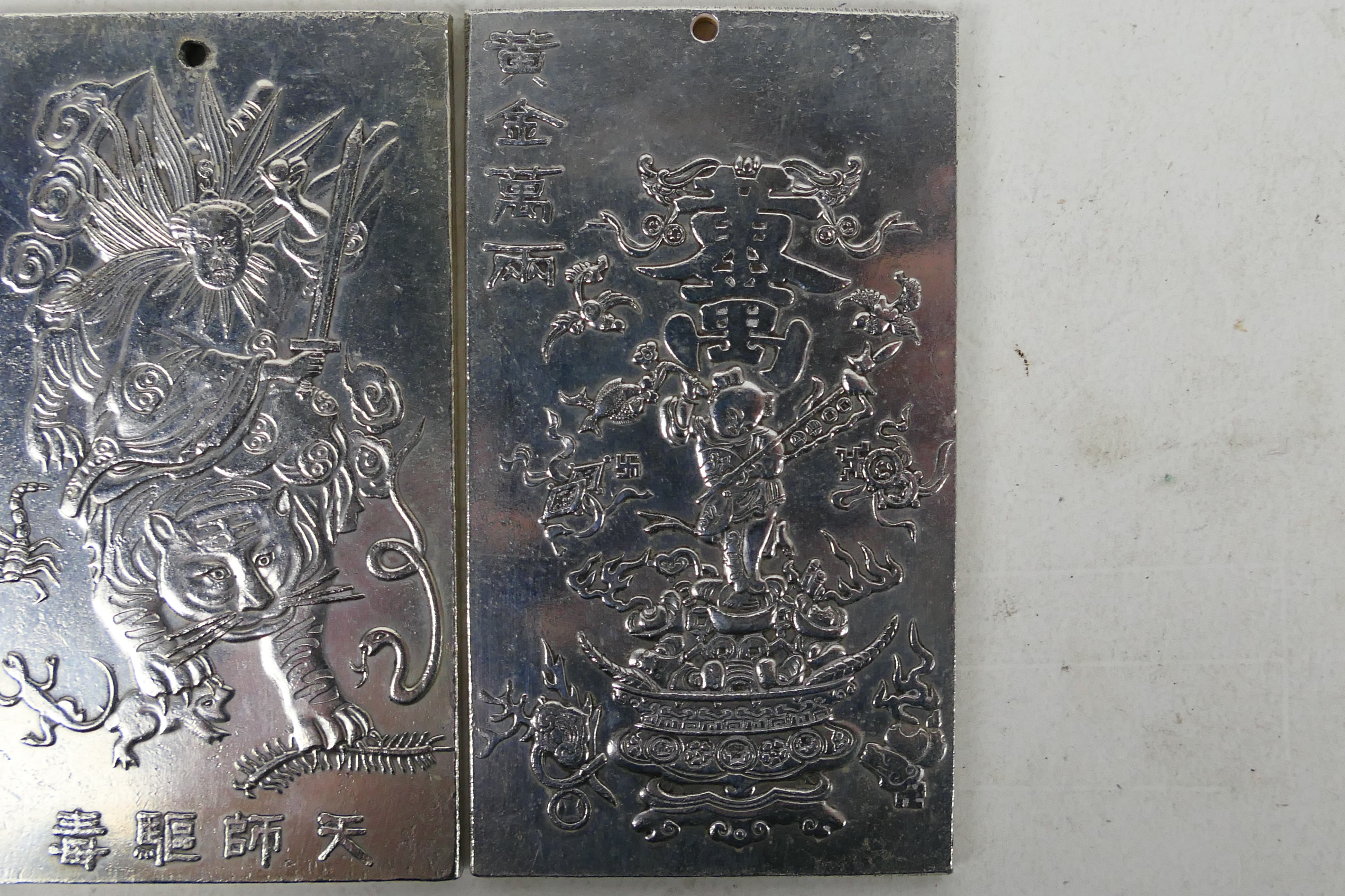 Two Chinese white metal plaques / trade tokens one decorated with a warrior riding a tiger, - Image 3 of 6