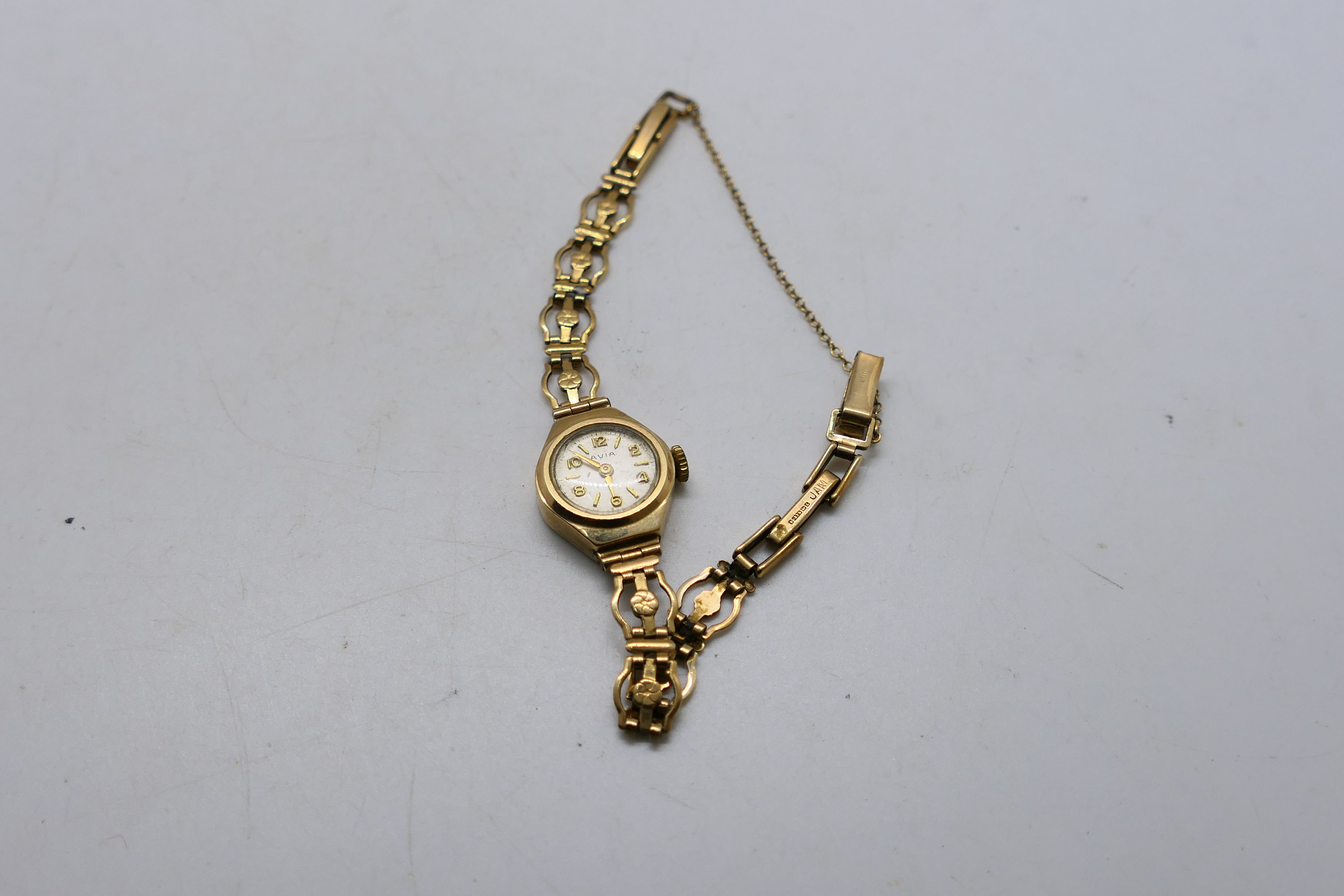 A lady's 9ct gold cased Avia wrist watch on 9ct gold bracelet, 8.6 grams excluding movement.