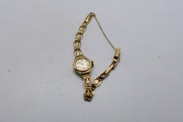 A lady's 9ct gold cased Avia wrist watch on 9ct gold bracelet, 8.6 grams excluding movement.