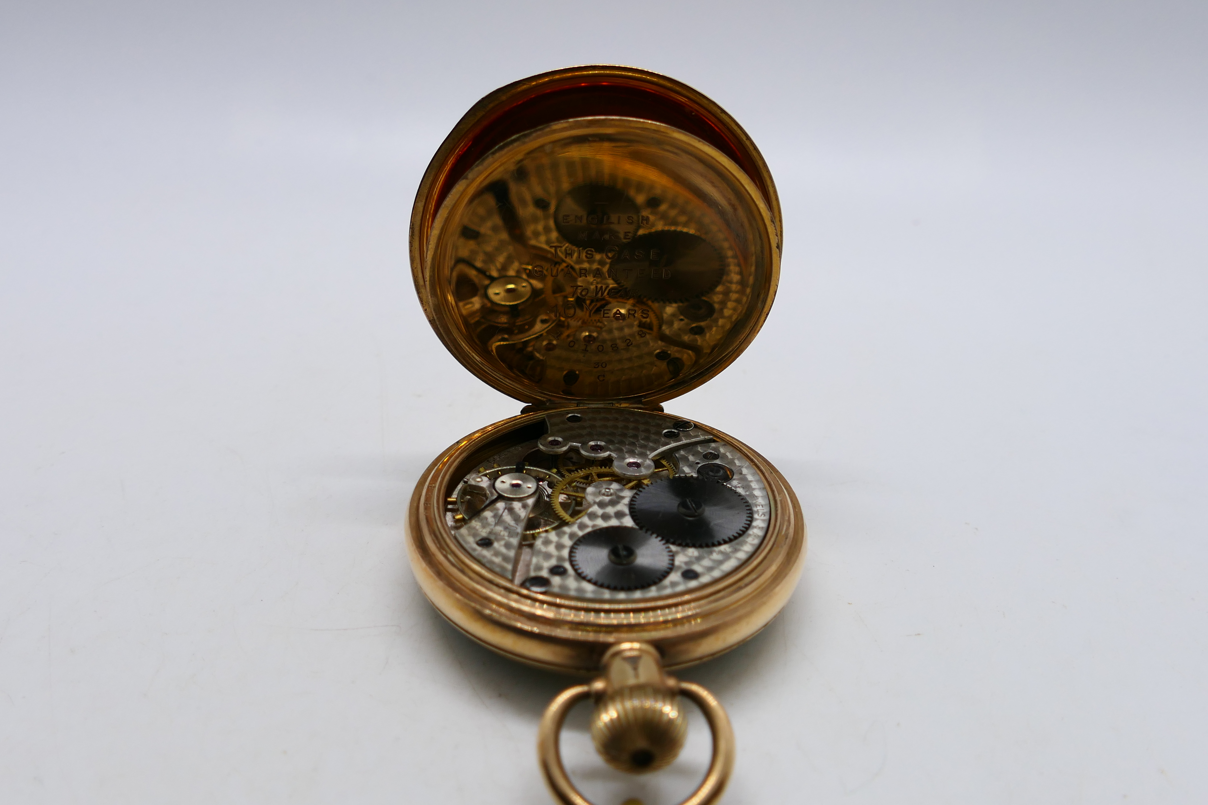 A gold plated open face pocket watch, Arabic numerals to a white enamel dial, - Image 4 of 8