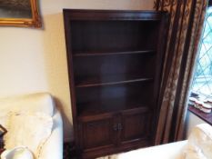 A carved oak bookcase,