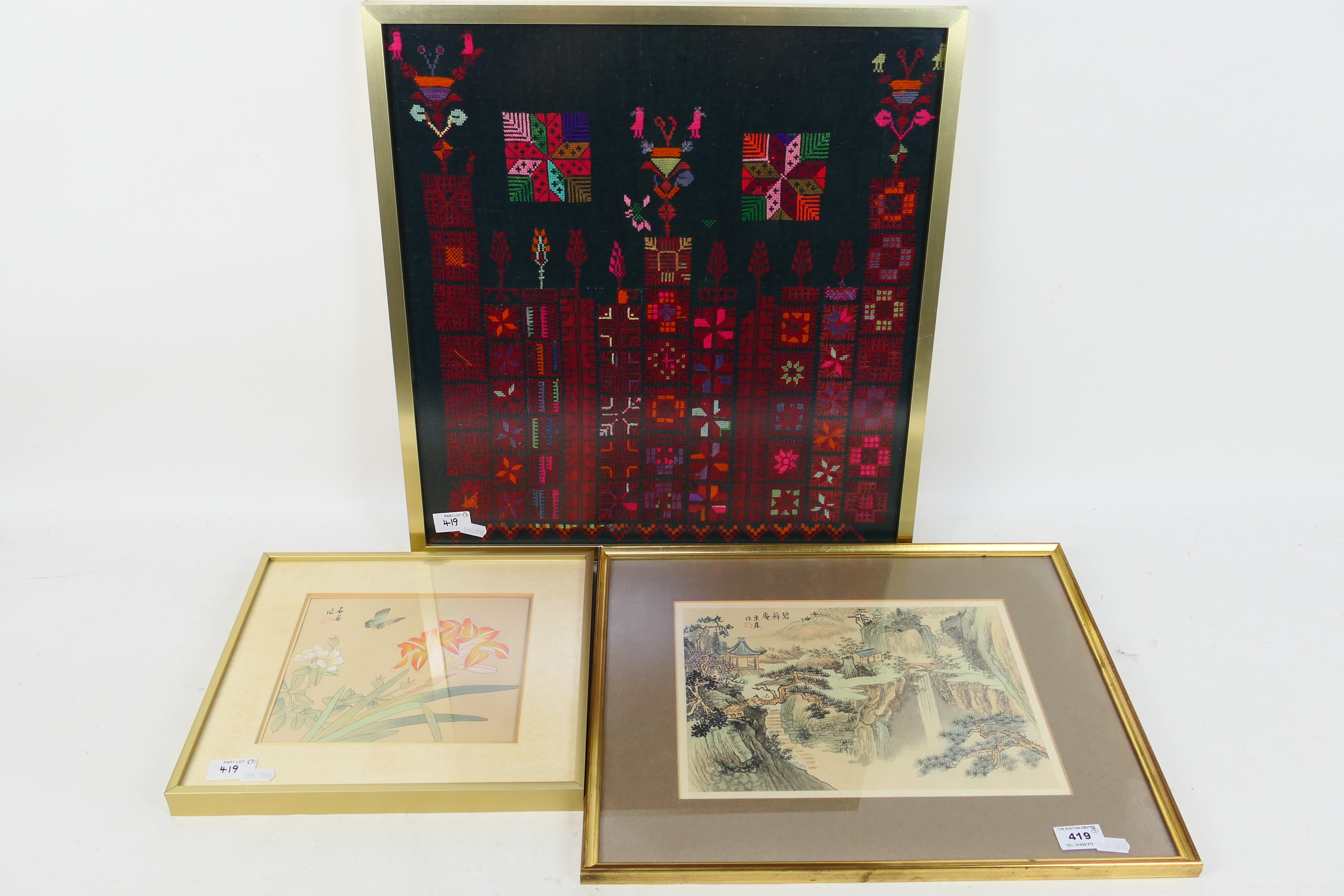 A Chinese landscape scene on silk, mounted and framed under glass, approximately 22 cm x 30 cm,