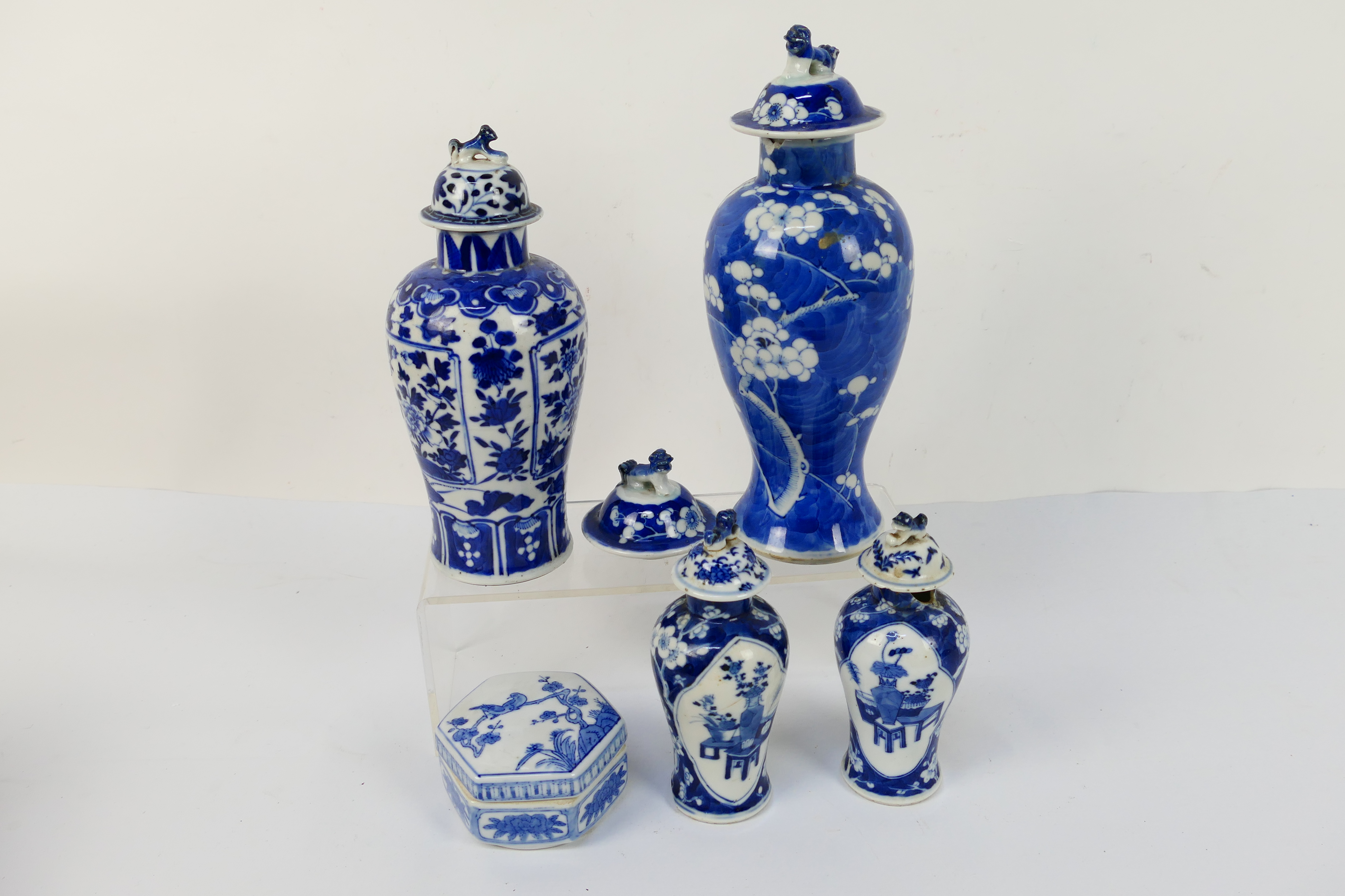 A group of 19th Century blue and white Chinese pottery covered vases of varying heights ranging