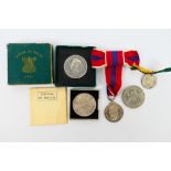 A group of commemorative coins and medals to include Festival Of Britain crown in box of issue,