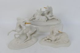 Three Franklin Mint porcelain figures / groups of Unicorns modelled by David Cornell comprising