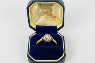 An 18ct yellow gold diamond cluster ring, size R+½, approximately 3.3 grams.