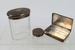 Lot to include a silver snuff box, Birmingham assay 1947 and two silver lidded dressing table jars,