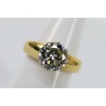 An 18ct yellow gold solitaire Diamond ring comprising one round brilliant cut Diamond set in a