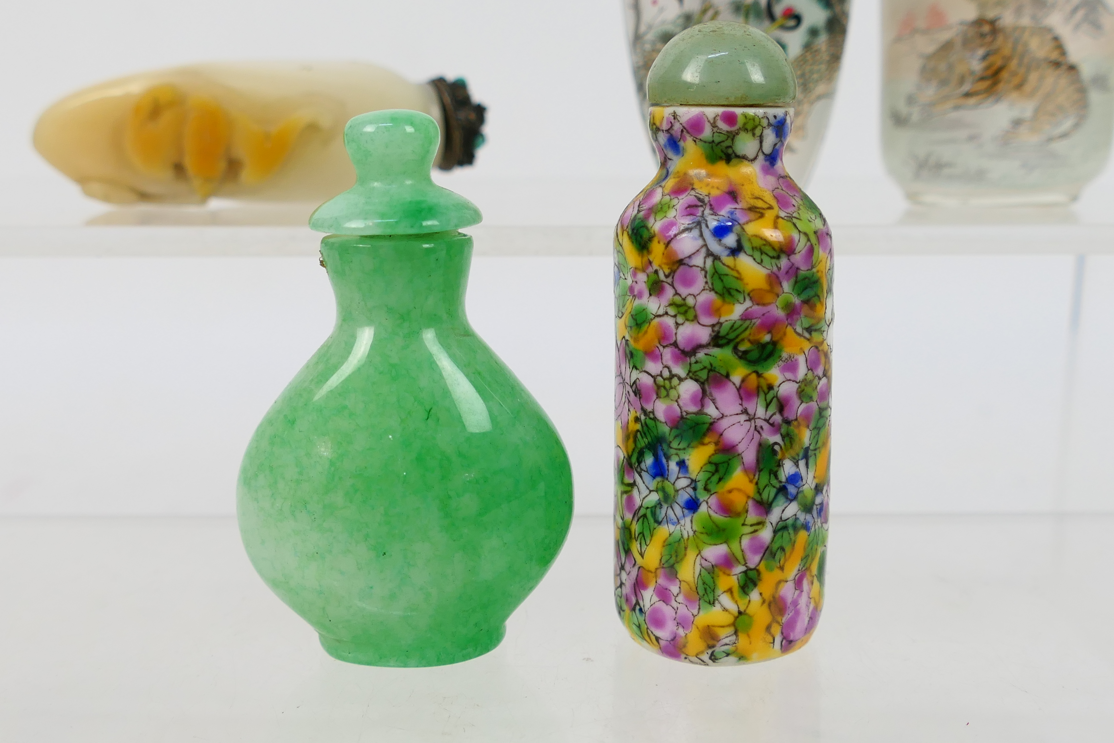 A collection of snuff bottles to include glass, ceramic, hardstone and other. - Image 13 of 14