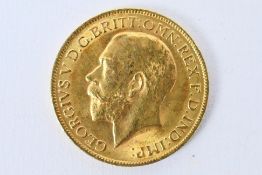 A Gold Sovereign - George V 1913 Condition Report: A full sovereign weighing approximately 8 grams.