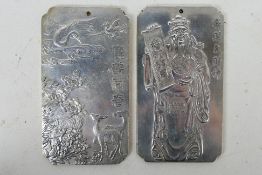 Two Chinese white metal trade tokens / plaques one decorated with cranes and deer,