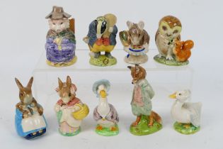 A group of nine Beatrix Potter figures, eight Beswick and one Royal Albert,