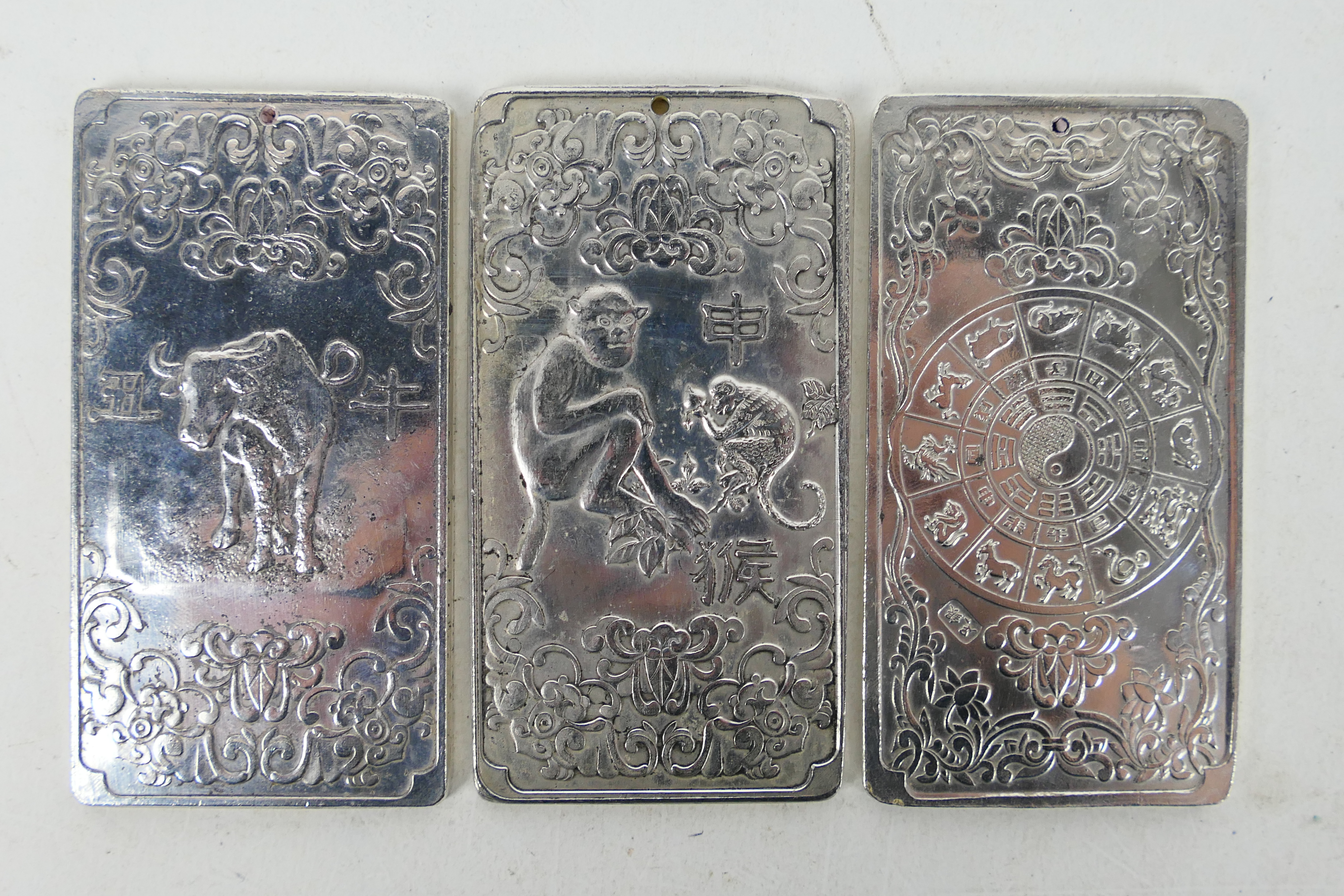 Three Chinese white metal trade tokens /