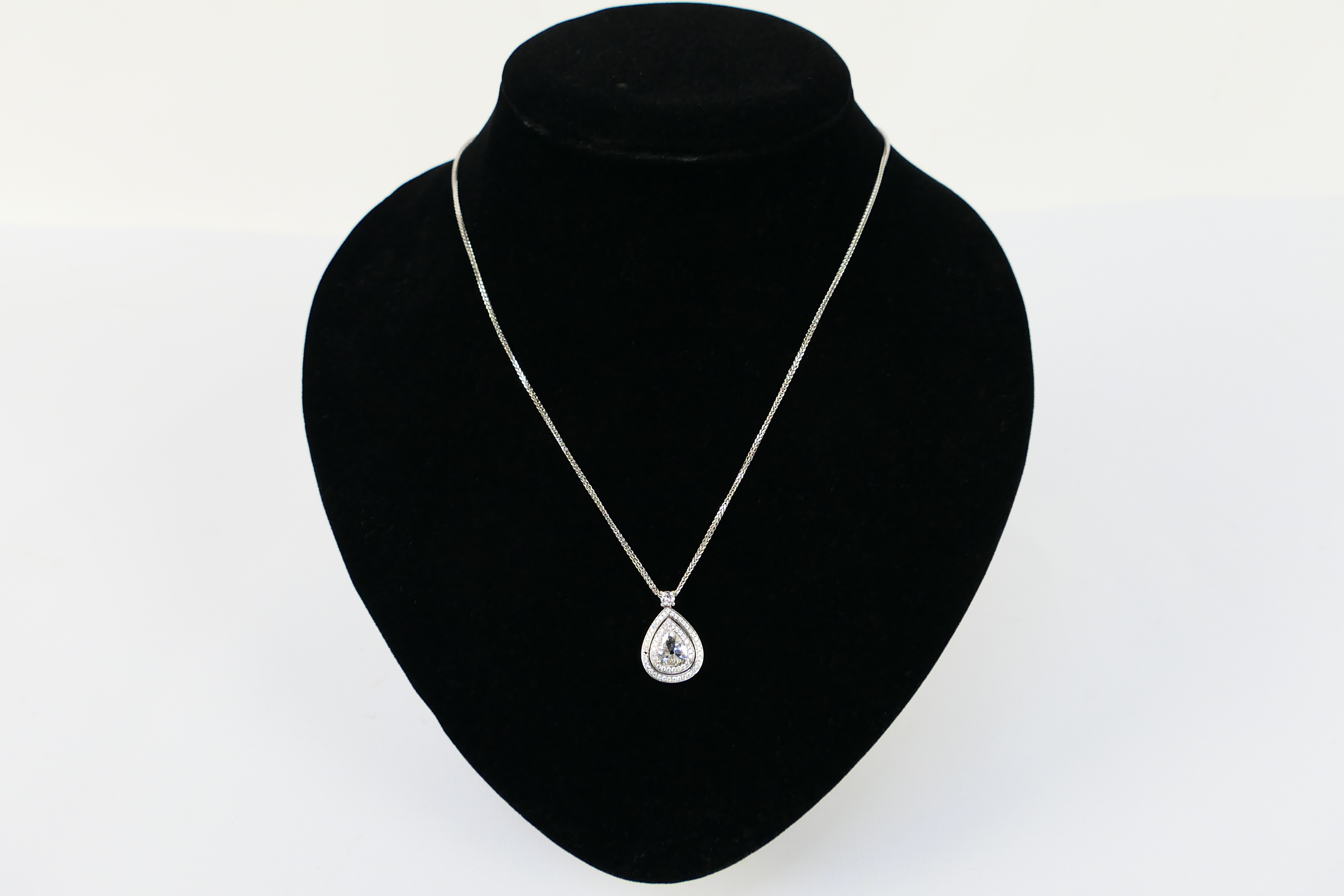 An 18ct white gold Diamond pendant conta - Image 2 of 11