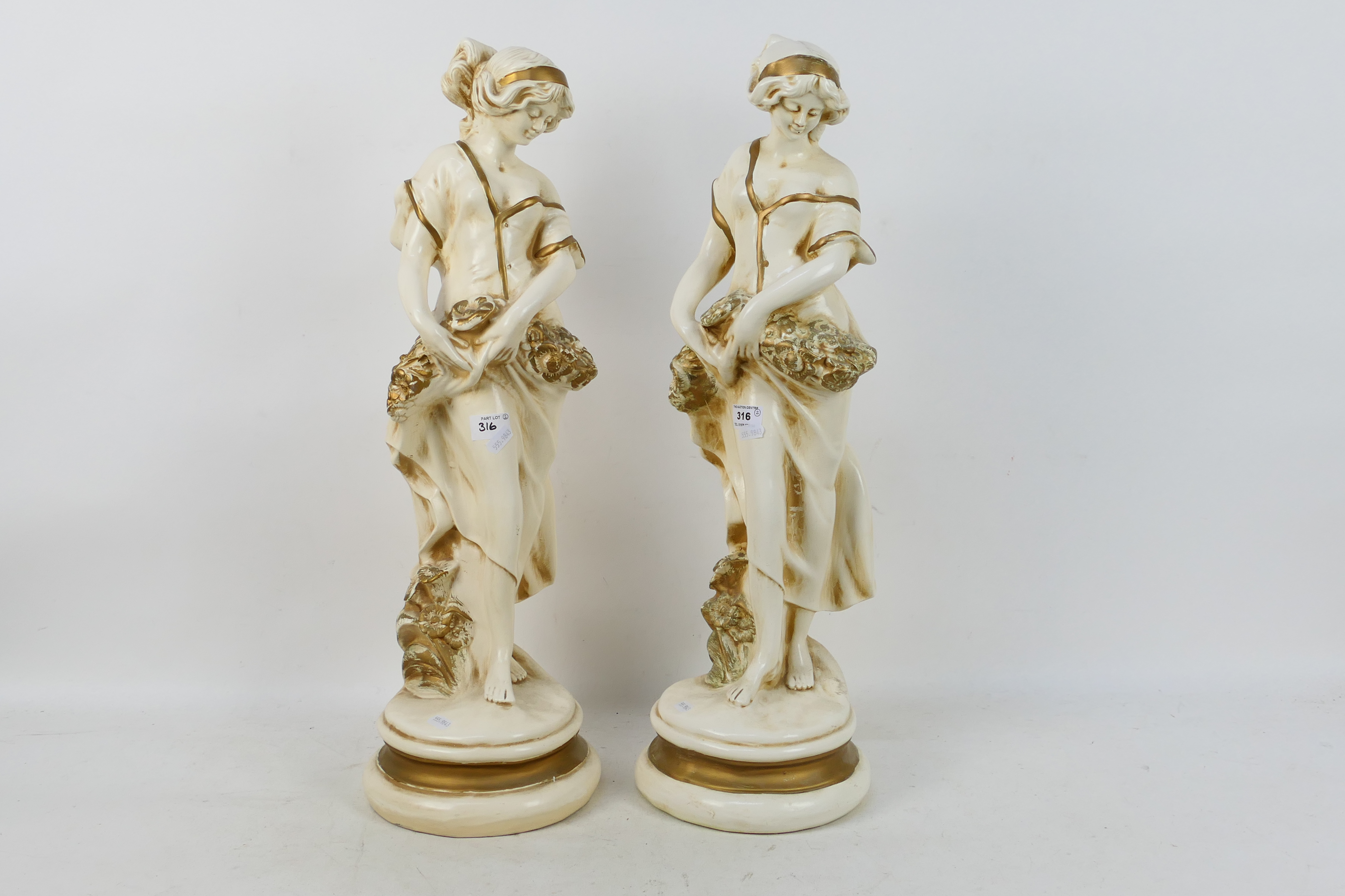 A pair of large figures depicting female