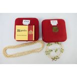 A boxed simulated Pearl and Jade necklac
