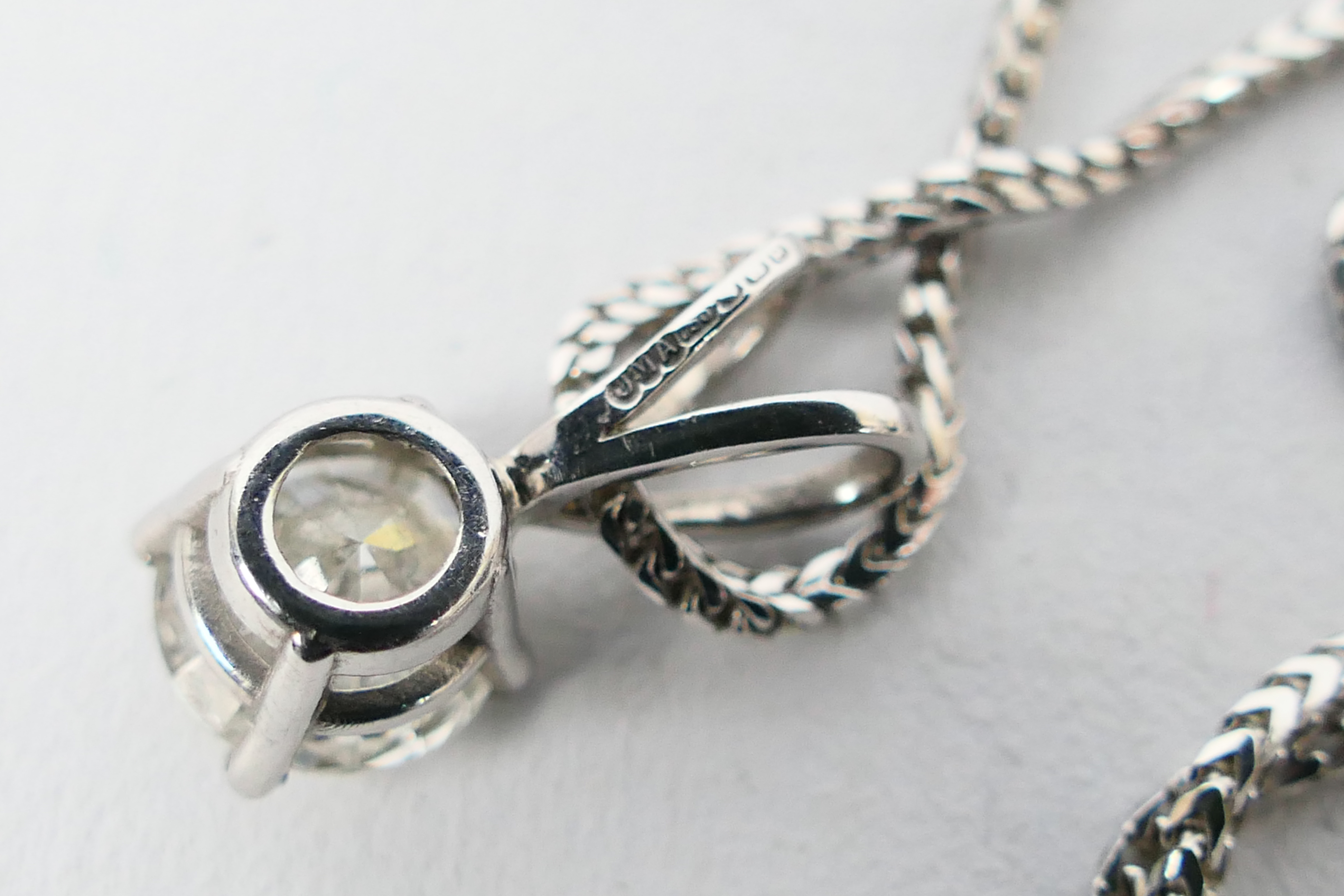 An 18ct white gold Diamond pendant conta - Image 4 of 4