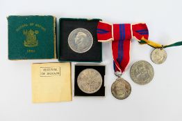 A group of commemorative coins and medal