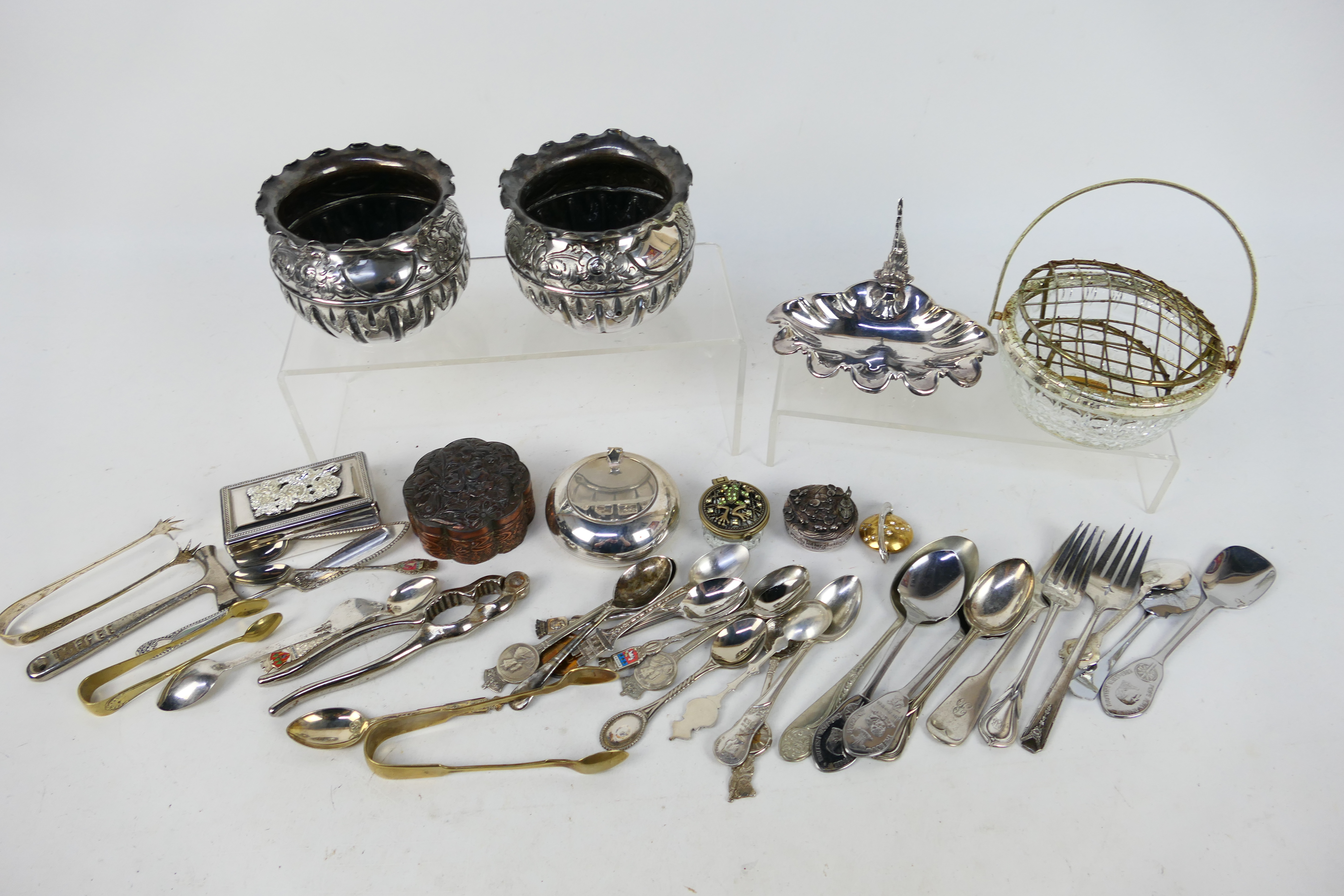 A collection of metal and plated ware to