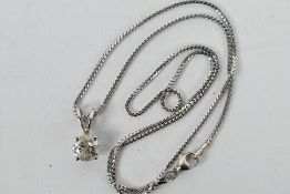 An 18ct white gold Diamond pendant conta