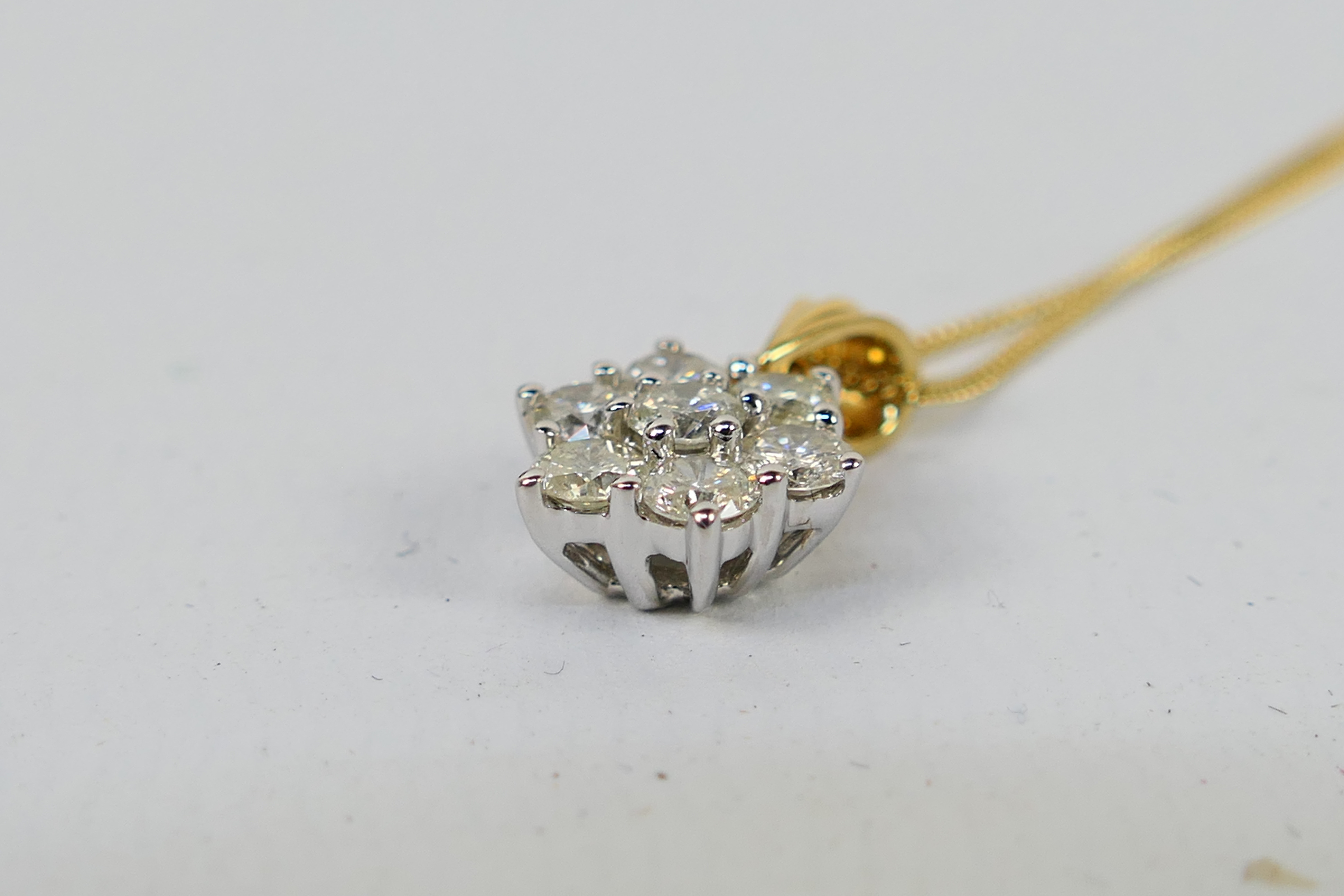 An 18ct white gold Diamond pendant conta - Image 8 of 8