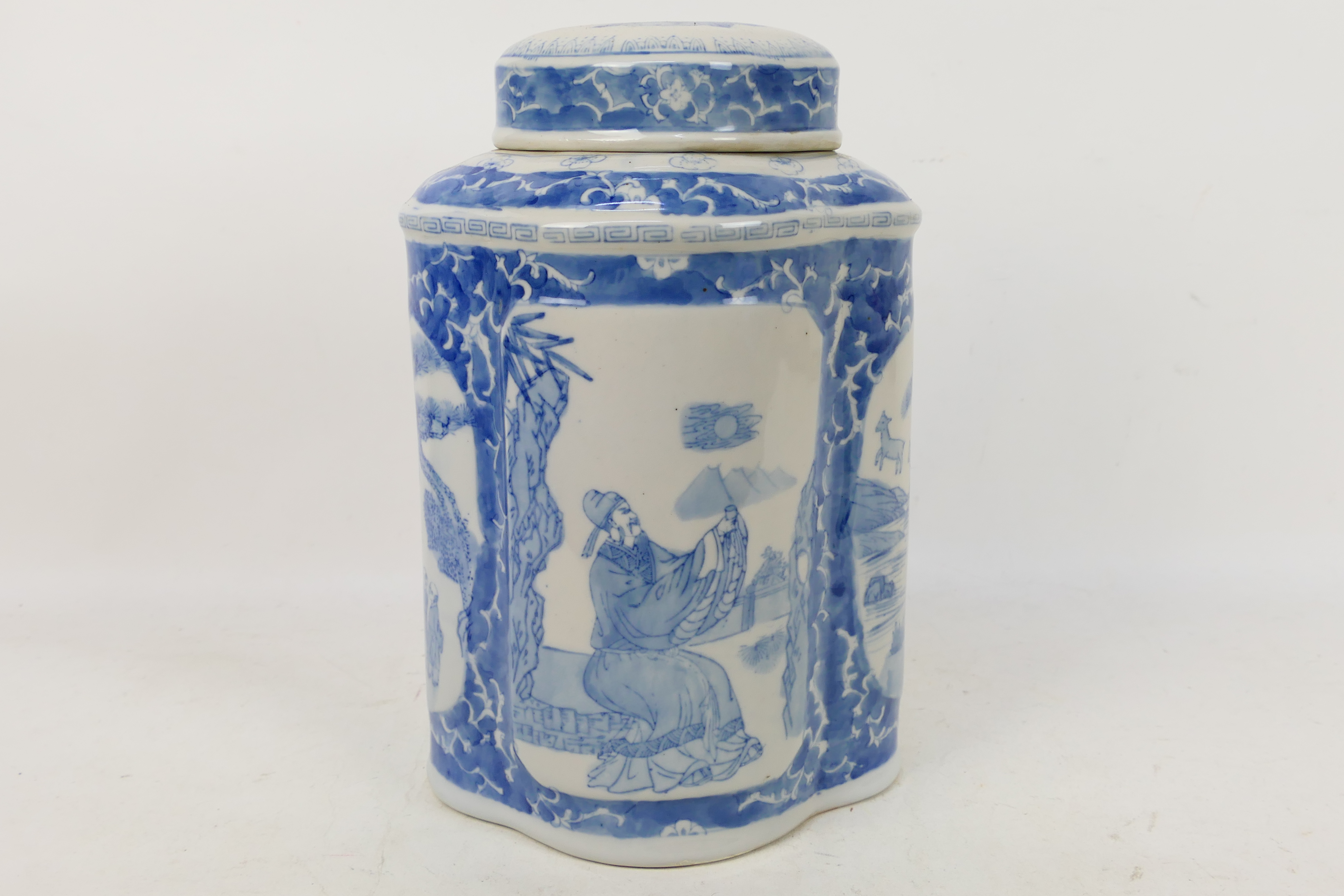 A large blue and white lidded jar of elo