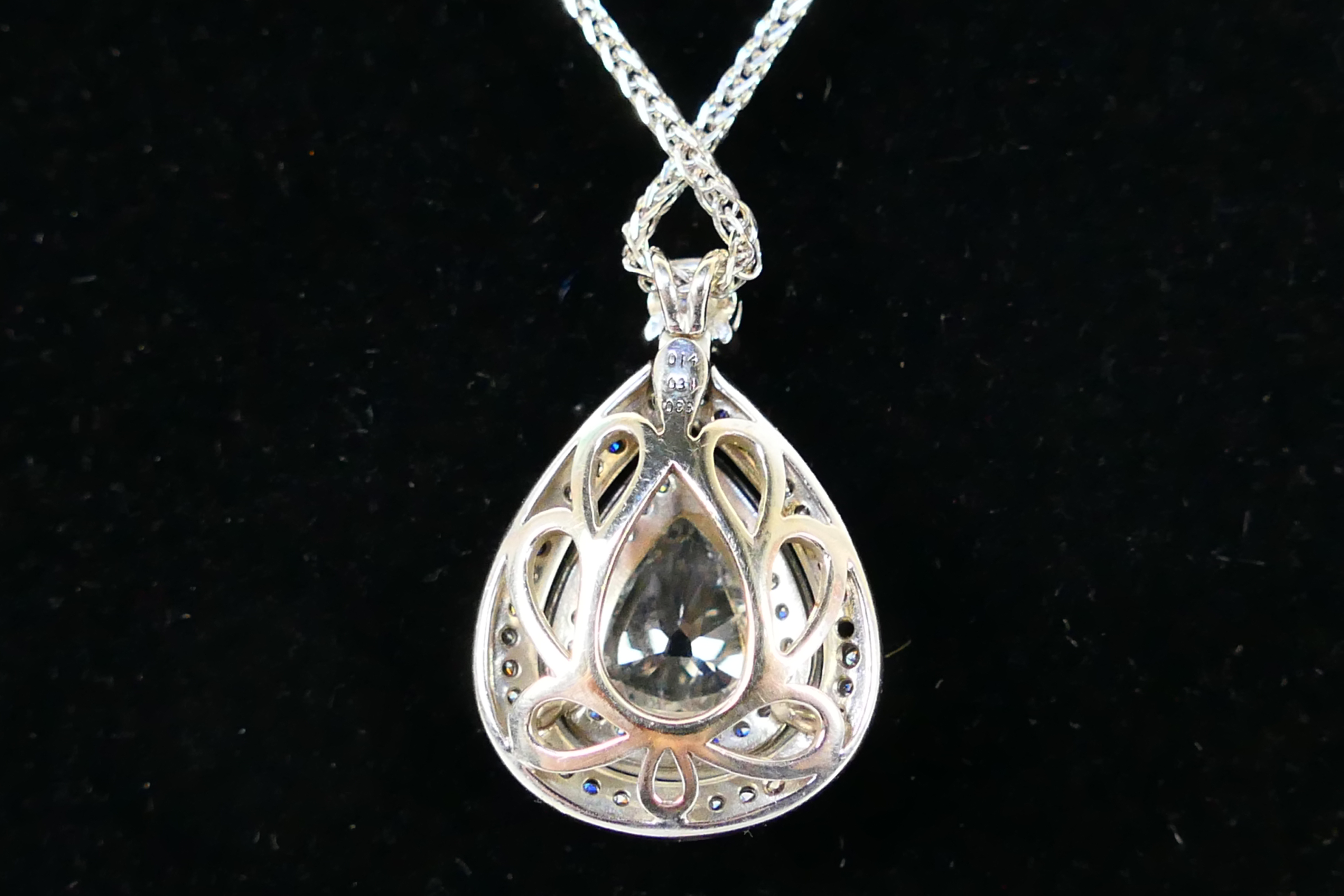 An 18ct white gold Diamond pendant conta - Image 6 of 11