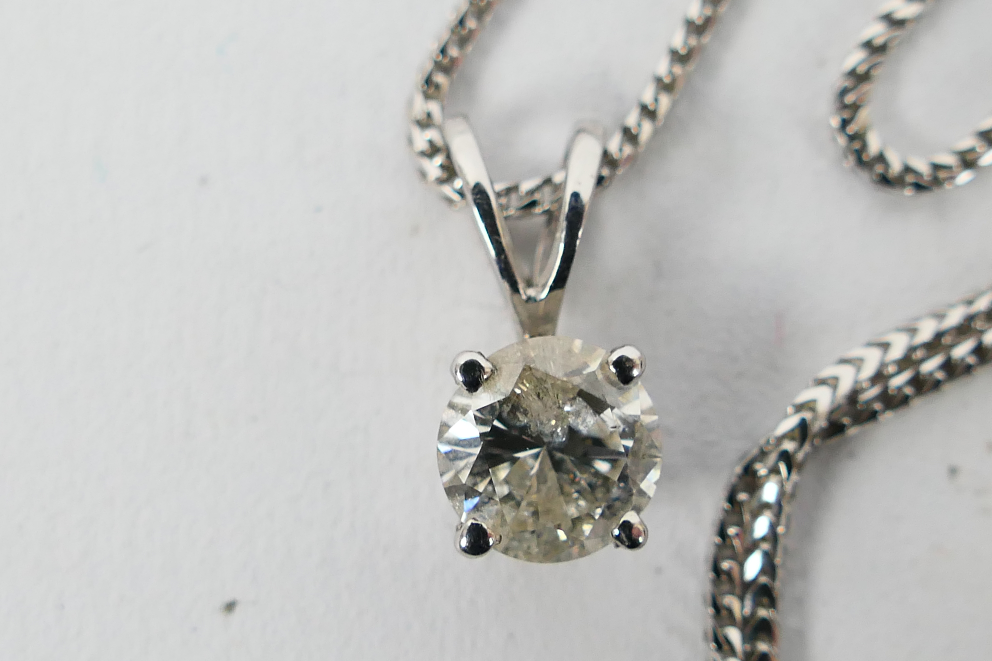 An 18ct white gold Diamond pendant conta - Image 2 of 4