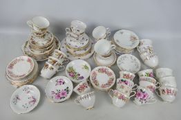 A collection of floral decorated tea wares comprising cups saucers and plates.