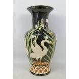 A large baluster vase decorated with swans, approximately 52 cm (h).