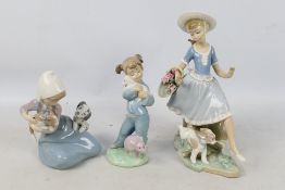 Three Spanish porcelain figures / groups by Lladro and Nao comprising Mirth In The Country # 4920,