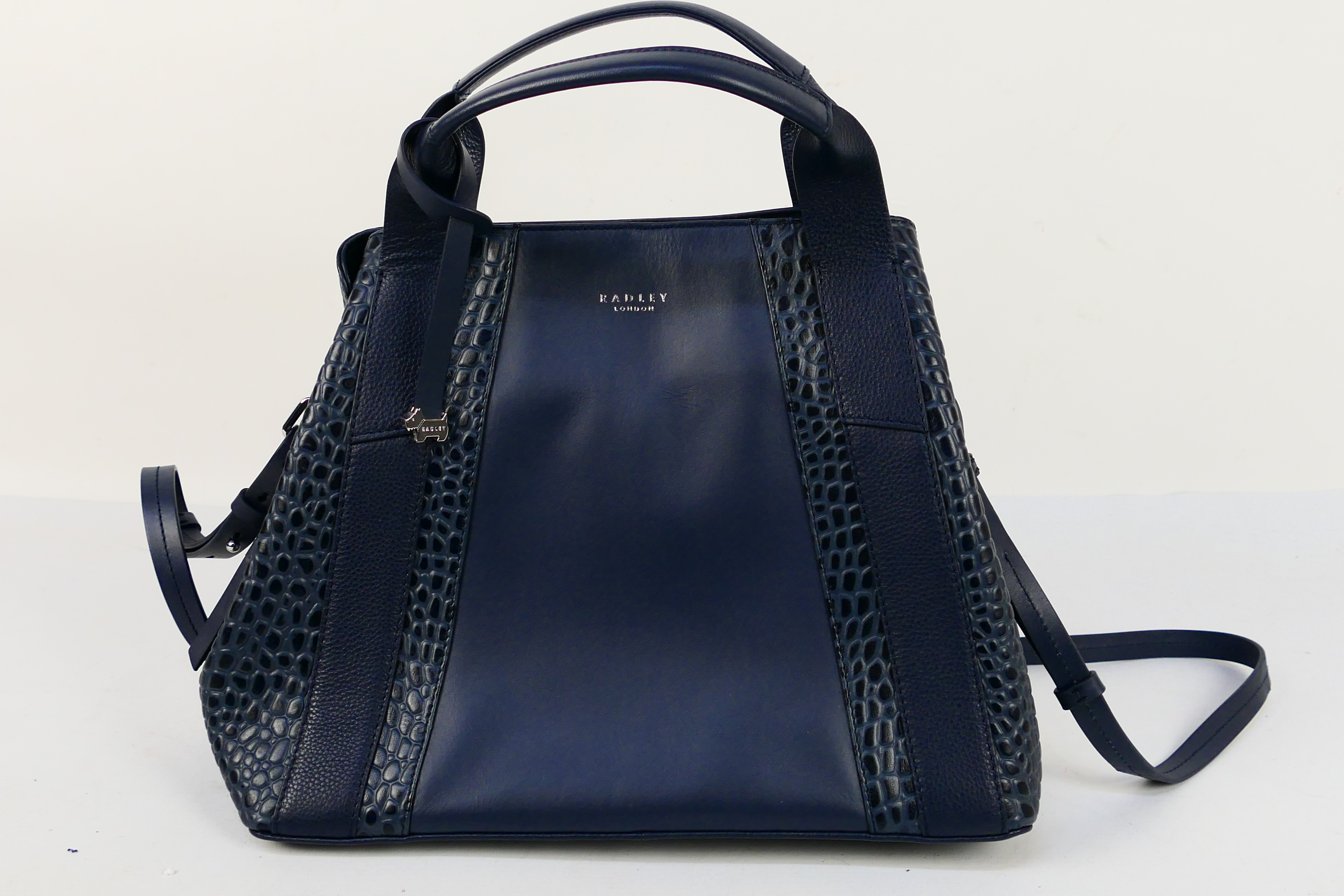 Radley - A dark blue Radley London leather handbag - Handbag has two interior zip pockets,