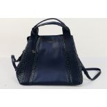 Radley - A dark blue Radley London leather handbag - Handbag has two interior zip pockets,