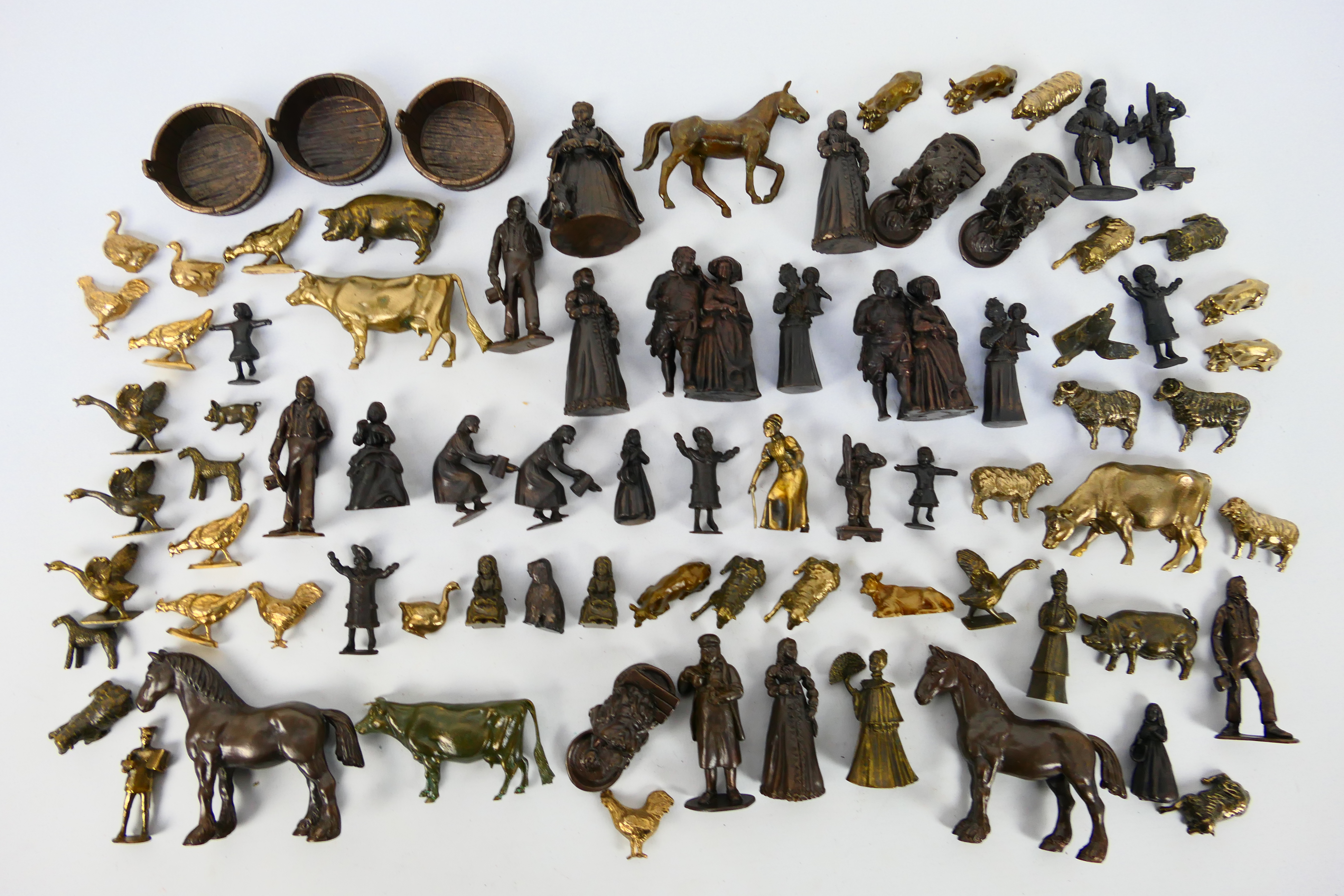 A large collection of bronze figures to include Victorian style, servants, children,