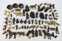 A large collection of bronze figures to include Victorian style, servants, children,