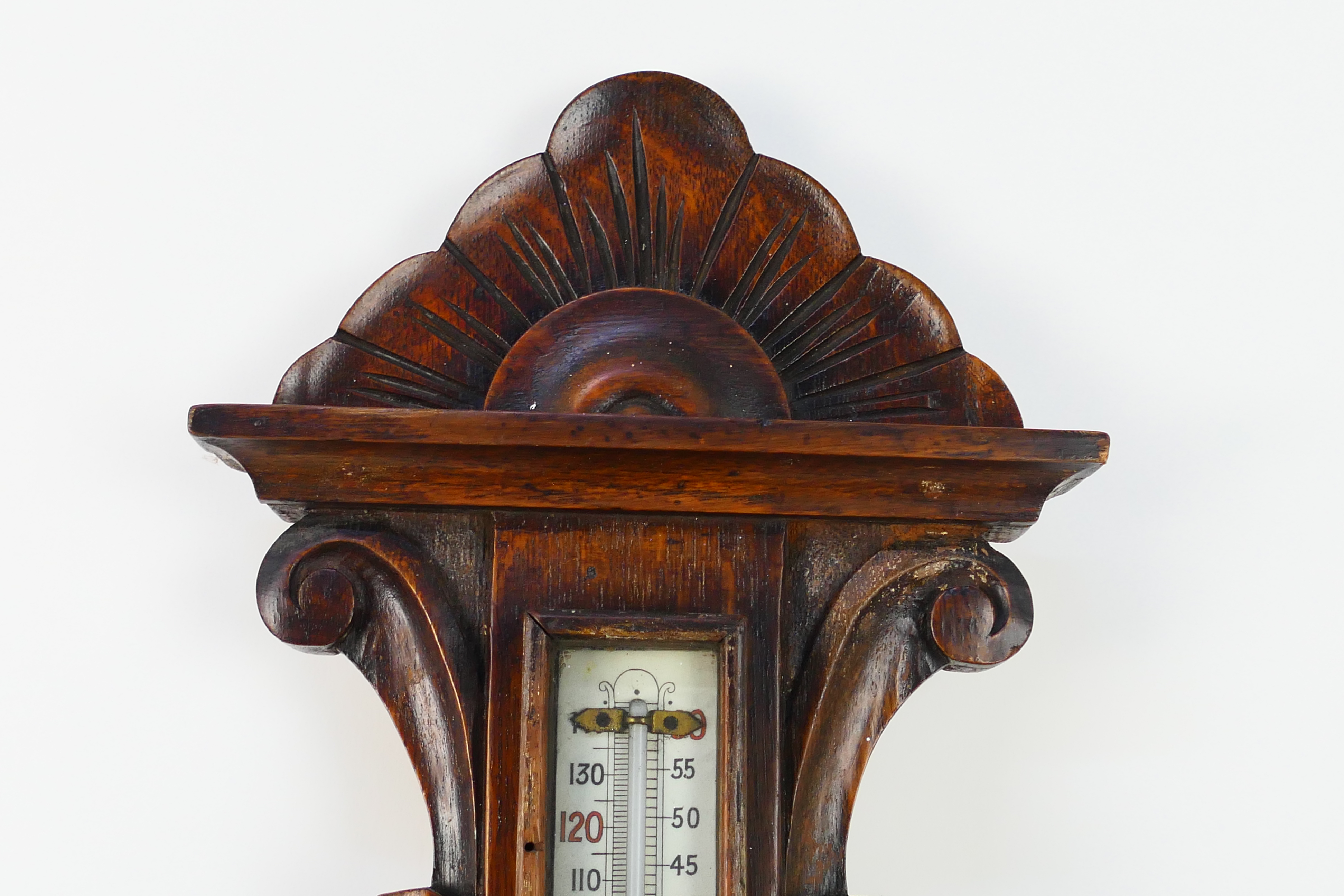 An oak cased aneroid barometer with carved decoration, marked to the dial Eustance & Co Warrington, - Image 4 of 5