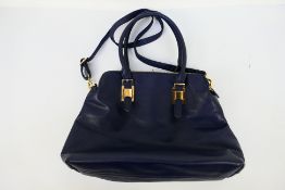 Principles - A dark blue Principles leather handbag with shoulder strap - Bag has one inner zip