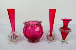 Cranberry Glass - a pair of cranberry glass solifleur vases on clear glass frilled supports 22 cm