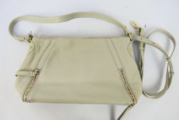 Radley - A white/cream Radley London leather handbag - Handbag has one interior zip pocket and two