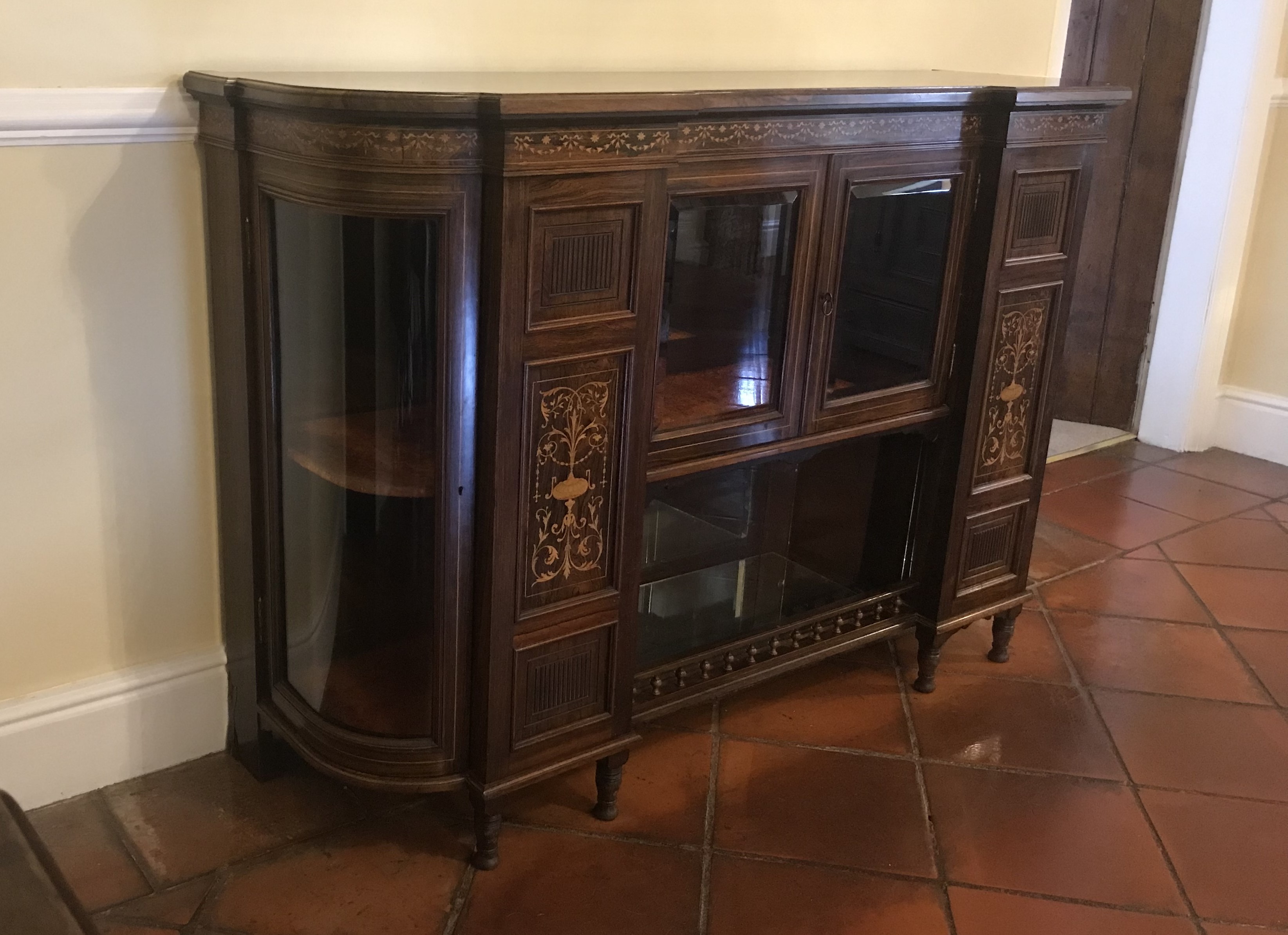 A good quality inverted breakfront credenza with inlaid decoration,